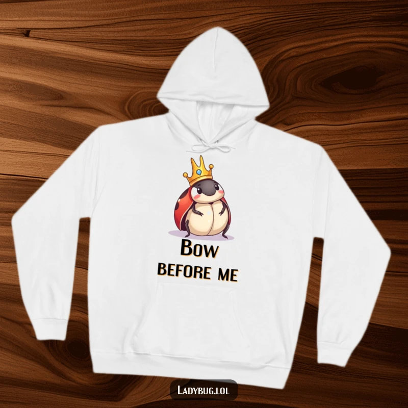 Funny Ladybug Hoodie: Plush hoodie with a crowned ladybug comically surveying its domain, exuding tiny regal authority.
