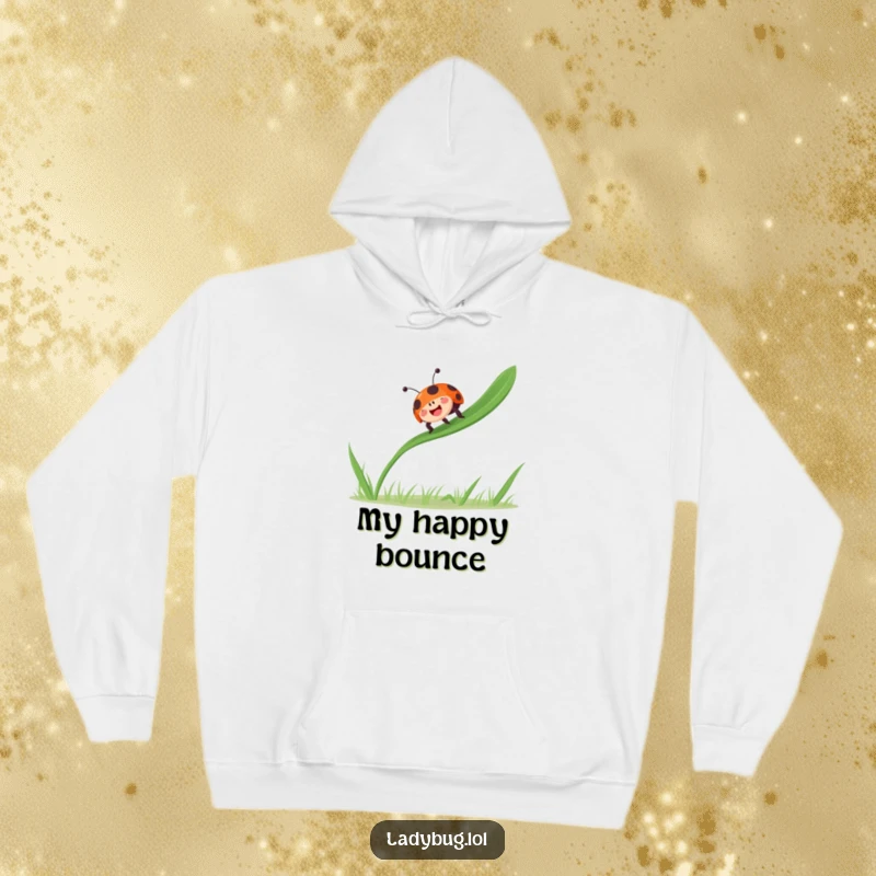 Funny ladybug bounces gleefully on a single blade of grass, radiating joy on a cozy hoodie.