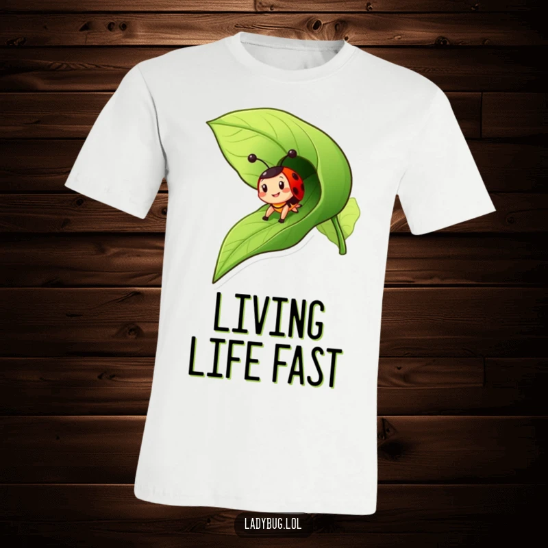 Funny ladybug t-shirt featuring a cheerful insect character zooming down a leaf as if it were a slide, full of glee.